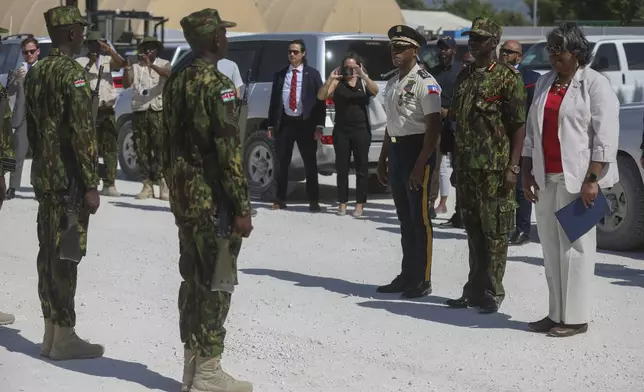 U.S. Ambassador to the United Nations Linda Thomas-Greenfield, right, Godfrey Otunga, Kenyan head of UN-backed multinational force, second from right, and Haitian Police Chief Normil Rameau attend a welcome demonstration from Kenyan police at their base in Port-au-Prince, Haiti, Monday, July 22, 2024. (AP Photo/Odelyn Joseph)