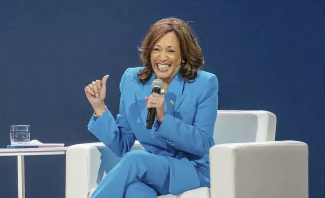 Vice President Kamala Harris laughs during a conversation with Essence CEO Caroline Wanga during the 30th annual Essence Festival of Culture in New Orleans, Saturday, July 6, 2024. (Matthew Perschall/The Times-Picayune/The New Orleans Advocate via AP)