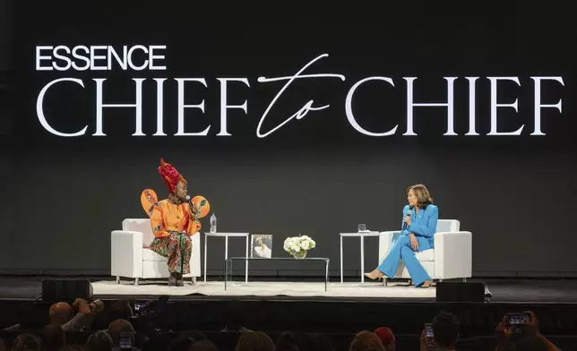 Vice President Kamala Harris, right, speaks with Essence CEO Caroline Wanga during the 30th annual Essence Festival of Culture in New Orleans, Saturday, July 6, 2024. (Matthew Perschall/The Times-Picayune/The New Orleans Advocate via AP)