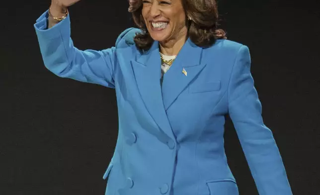 Vice President Kamala Harris waves as she walks on stage during the 30th annual Essence Festival of Culture in New Orleans, Saturday, July 6, 2024. (Matthew Perschall/The Times-Picayune/The New Orleans Advocate via AP)