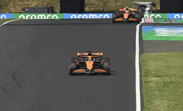 McLaren driver Oscar Piastri of Australia steers his car during the Hungarian Formula One Grand Prix race at the Hungaroring racetrack in Mogyorod, Hungary, Sunday, July 21, 2024. (AP Photo/Denes Erdos)