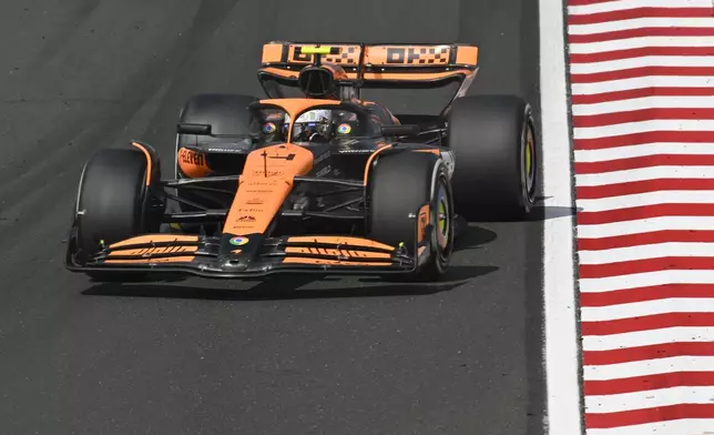 McLaren driver Lando Norris of Britain steers his car during the Hungarian Formula One Grand Prix race at the Hungaroring racetrack in Mogyorod, Hungary, Sunday, July 21, 2024. (AP Photo/Denes Erdos)