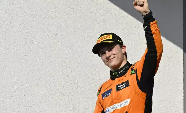 McLaren driver Oscar Piastri of Australia celebrates after winning the Hungarian Formula One Grand Prix race at the Hungaroring racetrack in Mogyorod, Hungary, Sunday, July 21, 2024. (AP Photo/Denes Erdos)