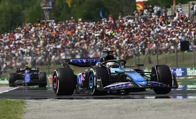 Alpine driver Esteban Ocon of France steers his car during the Hungarian Formula One Grand Prix race at the Hungaroring racetrack in Mogyorod, Hungary, Sunday, July 21, 2024. (AP Photo/Denes Erdos)