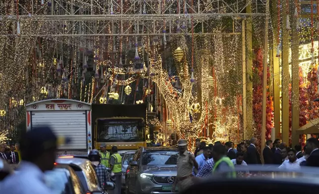 FILE - Decorations are seen outside Antilla, the residence of Mukesh Ambani, during a pre-wedding ceremony of his son Anant Ambani and Radhika Merchant, in Mumbai, India, Wednesday, July 3, 2024. (AP Photo/Rafiq Maqbool, File)