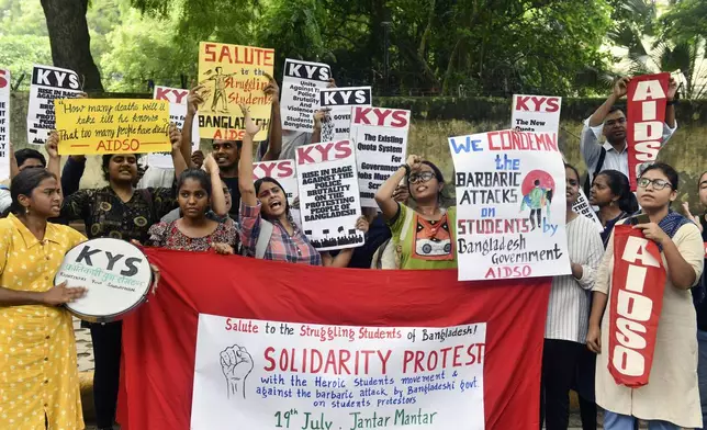 Activists of All India Democratic Students' Organisation (AIDSO) shout slogans in solidarity with protesting students in Bangladesh, at a protest gathering in New Delhi, India, Friday, July 19, 2024. (AP Photo)