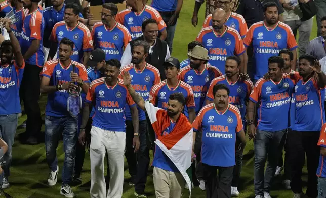 India's cricket team takes a victory lap during a ceremony at Wankhede Stadium, Thursday, July 4, 2024, in Mumbai, India, after winning the ICC Men's Twenty20 World Cup. (AP Photo/Rafiq Maqbool)