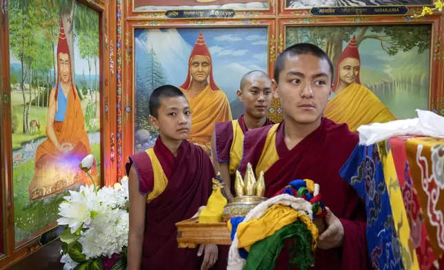 Exiled Tibetan monks carry ceremonial offerings at an event to celebrate the 89th birthday of their spiritual leader the Dalai Lama at the Tsuglakhang temple in Dharamshala, India, Saturday, July 6, 2024. (AP Photo/Ashwini Bhatia)