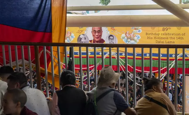 Exiled Tibetans watch a cultural performance from a balcony at an event to celebrate the 89th birthday of their spiritual leader the Dalai Lama at the Tsuglakhang temple in Dharamshala, India, Saturday, July 6, 2024. (AP Photo/Ashwini Bhatia)