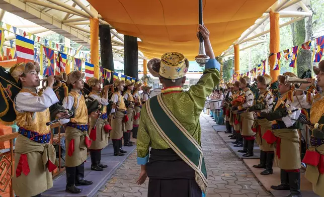 A band from the Tibetan Institute of Performing Arts plays at an event to celebrate the 89th birthday of Tibetan spiritual leader the Dalai Lama at the Tsuglakhang temple in Dharamshala, India, Saturday, July 6, 2024. (AP Photo/Ashwini Bhatia)