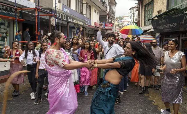 Activists and supporters of the LGBTQ community participate in a Pride walk in Dharamshala, India, Sunday, June 30, 2024. (AP Photo/Ashwini Bhatia)