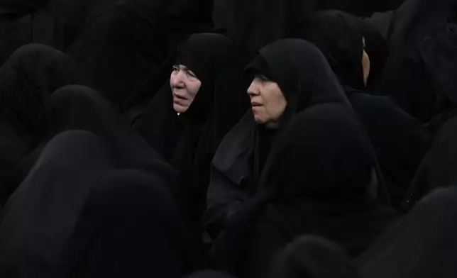 Shiite Muslim women mourn during Ashoura ritual, commemorating the 7th century martyrdom of Prophet Muhammad's grandson, Hussein, in the battle of Karbala in present-day Iraq, at the old main bazaar of Tehran, Iran, Tuesday, July 16, 2024. Shiites represent over 10% of the world's 1.8 billion Muslims and view Hussein as the rightful successor to the Prophet Muhammad. (AP Photo/Vahid Salemi)