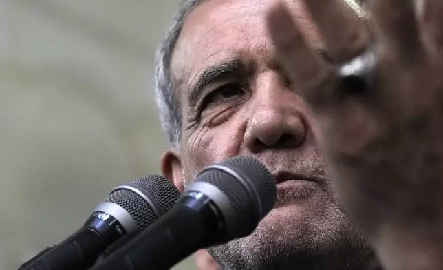 Iran's President-elect Masoud Pezeshkian speaks in a meeting a day after the presidential election, at the shrine of the late revolutionary founder Ayatollah Khomeini, just outside Tehran, Iran, Saturday, July 6, 2024. (AP Photo/Vahid Salemi)