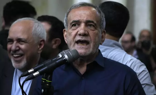 Iran's President-elect Masoud Pezeshkian speaks in a meeting a day after the presidential election, at the shrine of the late revolutionary founder Ayatollah Khomeini, just outside Tehran, Iran, Saturday, July 6, 2024. (AP Photo/Vahid Salemi)