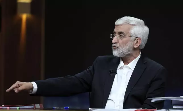 In this photo made available by Iranian state-run TV, IRIB, hard-line candidate for Iran's presidential election Saeed Jalili speaks during a debate with reformist candidate Masoud Pezeshkian at the TV studio in Tehran, Iran, Tuesday, July 2, 2024. Iran will hold a runoff presidential election Friday, only its second since the 1979 Islamic Revolution, after only 39.9% of its voting public cast a ballot the previous week. (Morteza Fakhri Nezhad/IRIB via AP)