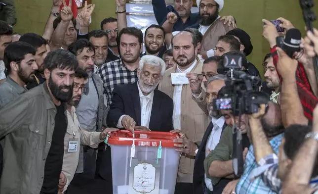 Candidate for the Iran's presidential election Saeed Jalili, a hard-line former nuclear negotiator, casts his vote for the presidential runoff election at a polling station in Qarchak near Tehran, Iran, Friday, July 5, 2024. Iran was holding a runoff presidential election Friday pitting a hard-line former nuclear negotiator against a reformist lawmaker, though both men earlier struggled to convince a skeptical public to cast ballots in the first round that saw the lowest turnout in the Islamic Republic's history. (AP Photo)