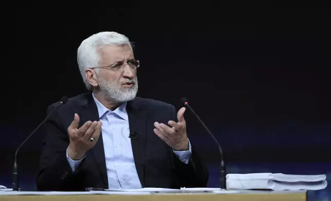 In this photo made available by Iranian state-run TV, IRIB, Iranian presidential candidate Saeed Jalili, a hard-line former nuclear negotiator, speaks during a debate with reformist candidate Masoud Pezeshkian at the TV studio in Tehran, Iran, Monday, July 1, 2024. (Morteza Fakhri Nezhad/IRIB via AP)