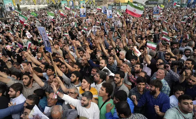 Supporters of Saeed Jalili, a candidate for the Iran's presidential election, attend his campaign meeting in Tehran, Iran, Monday, June 24, 2024. Comments suggesting that Iran's reformist presidential candidate could increase government-set gasoline prices have raised fears of a repeat of nationwide protests. (AP Photo/Vahid Salemi)