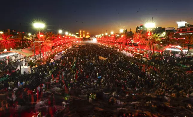 Iraqi Shiites mark the month of Muharram in Karbala, Iraq, on Tuesday, July 16, 2024. Muharram commemorates the death of Prophet Muhammed's grandson, Hussein Ibn Ali, who was killed during the Battle of Karbala on the tenth day of Muharram, known as the Day of Ashoura. ( (AP Photo/Anmar Khalil)