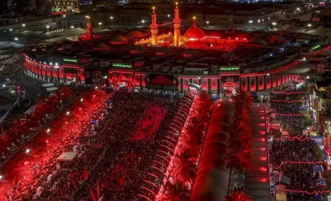 Iraqi Shiites mark the month of Muharram in Karbala, Iraq, on Tuesday, July 16, 2024. Muharram commemorates the death of Prophet Muhammed's grandson, Hussein Ibn Ali, who was killed during the Battle of Karbala on the tenth day of Muharram, known as the Day of Ashoura. ( (AP Photo/Anmar Khalil)