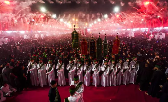 Iraqi Shiites mark the month of Muharram in Karbala, Iraq, on Tuesday, July 16, 2024. Muharram commemorates the death of Prophet Muhammed's grandson, Hussein Ibn Ali, who was killed during the Battle of Karbala on the tenth day of Muharram, known as the Day of Ashoura. ( (AP Photo/Anmar Khalil)