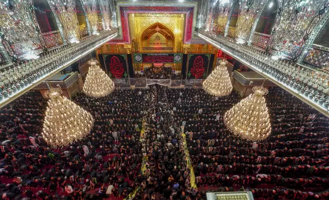 Iraqi Shiites mark the month of Muharram in Karbala, Iraq, on Tuesday, July 16, 2024. Muharram commemorates the death of Prophet Muhammed's grandson, Hussein Ibn Ali, who was killed during the Battle of Karbala on the tenth day of Muharram, known as the Day of Ashoura. ( (AP Photo/Anmar Khalil)