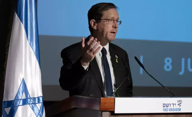 Israeli President Isaac Herzog speaks at the inauguration of The Moshal Shoah Legacy Campus and The David and Fela Shapell Family Collections Center, at Yad Vashem World Holocaust Remembrance Center in Jerusalem, Monday, July 8, 2024. Israel's national Holocaust museum opened a new conservation facility in Jerusalem, which will preserve, restore, and store the more than 45,000 artifacts and works of art in a vast new building, including five floors of underground storage. (AP Photo/Maya Alleruzzo)