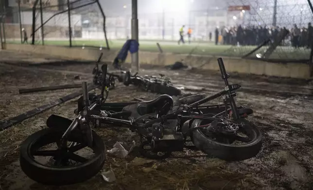 Bicycles sit next to the area that was hit by a rocket that killed multiple children and teenagers at a soccer field in the Druze town of Majdal Shams, in the Israeli-annexed Golan Heights, Saturday, July 27, 2024. (AP Photo/Leo Correa)