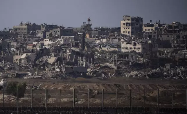 Destroyed buildings stand in the Gaza Strip, as seen from southern Israel, Monday, July 8, 2024. Israeli forces advanced deeper into the Gaza Strip's largest city in pursuit of militants who had regrouped there, sending thousands of Palestinians fleeing on Monday from an area ravaged in the early weeks of the nine-month-long war. (AP Photo/Leo Correa)