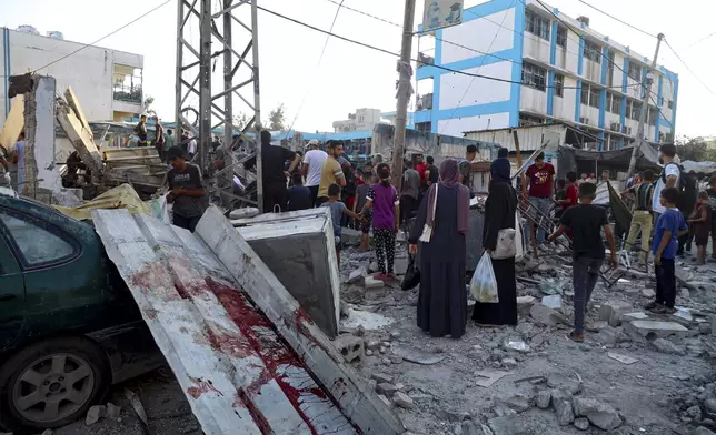 Blood can be seen in the aftermath of the Israeli airstrike on a U.N.-run school that killed dozens of Palestinians in the Nusseirat refugee camp in the Gaza Strip, Saturday, July 6, 2024. (AP Photo/Saher Alghorra)