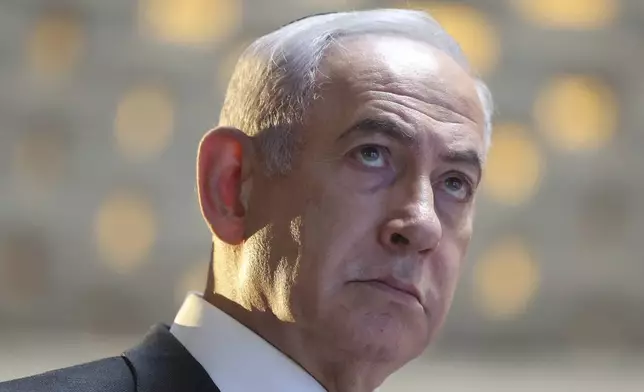 Israeli Prime Minister Benjamin Netanyahu attends a memorial ceremony for Israeli soldiers who fell in battle during the 2014 Gaza War, in the Hall of Remembrance at Mount Herzl Military Cemetery in Jerusalem on Tuesday, July 16, 2024. (Abir Sultan/Pool Photo via AP)