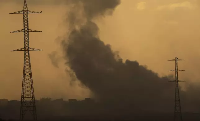 Smoke rises to the sky after an explosion in the Gaza Strip as seen from southern Israel, Monday, July 8, 2024. Israeli forces advanced deeper into the Gaza Strip's largest city in pursuit of militants who had regrouped there, sending thousands of Palestinians fleeing on Monday from an area ravaged in the early weeks of the nine-month-long war. (AP Photo/Leo Correa)