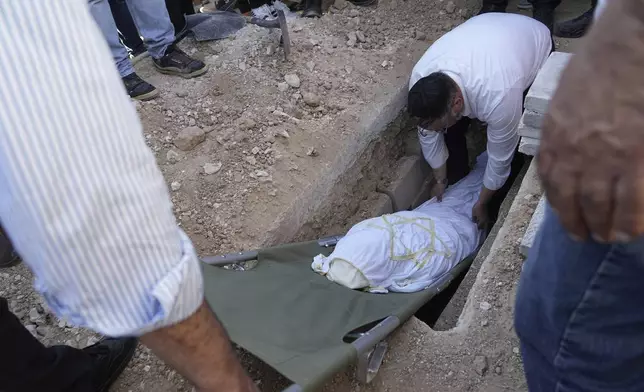 Liora Argamani, mother of a well-known Israeli hostage who was freed from captivity in Gaza in a rescue operation last month, is buried in Beersheba, Israel, Tuesday, July 2, 2024. Liora Argamani, 61, who had stage four brain cancer, had pleaded for the release of her daughter, Noa, saying she wanted to see her only child before she died. (AP Photo/Tsafrir Abayov)
