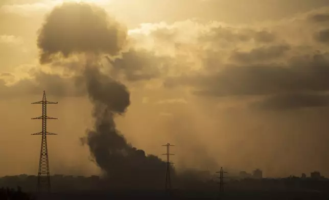 Smoke rises to the sky after an explosion in the Gaza Strip as seen from southern Israel, Monday, July 8, 2024. Israeli forces advanced deeper into the Gaza Strip's largest city in pursuit of militants who had regrouped there, sending thousands of Palestinians fleeing on Monday from an area ravaged in the early weeks of the nine-month-long war. (AP Photo/Leo Correa)