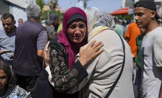 A Palestinian woman mourns her nephew, killed in the Israeli bombardment of the Gaza Strip, at a hospital in Deir al-Balah, Saturday, July 27, 2024. (AP Photo/Abdel Kareem Hana)