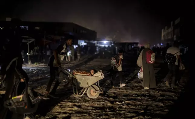 FILE - Palestinians displaced by the Israeli air and ground offensive on the Gaza Strip flee from parts of Khan Younis following an evacuation order by the Israeli army to leave the eastern part of Gaza Strip's second largest city on July 1, 2024. (AP Photo/Jehad Alshrafi, File)