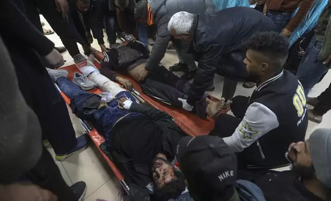 FILE - Palestinians wounded in the Israeli bombardment of the Gaza Strip are brought to Al Aqsa hospital in Deir al Balah, Gaza Strip, on March 25, 2024. (AP Photo/Ismael abu dayyah, File)