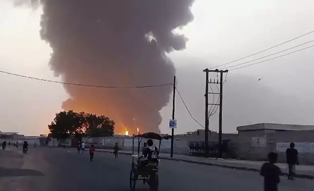 In this image from video, smoke and flames rise from a site in Hodeidah, Yemen, on Saturday, July 20, 2024. The Israeli army says it struck several Houthi targets in western Yemen following a fatal drone attack by the rebel group in Tel Aviv the previous day. (AP Photo)