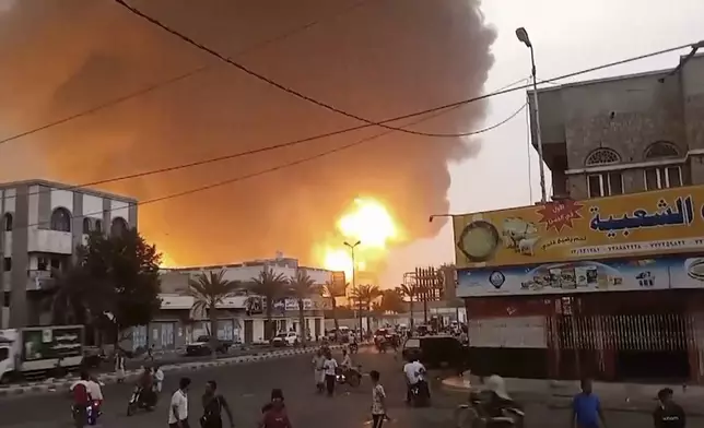 In this image from video, smoke and flames rise from a site in Hodeidah, Yemen, on Saturday, July 20, 2024. The Israeli army says it struck several Houthi targets in western Yemen following a fatal drone attack by the rebel group in Tel Aviv the previous day. (AP Photo)