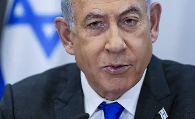 FILE - Israeli Prime Minister Benjamin Netanyahu chairs a cabinet meeting at the Kirya military base, which houses the Israeli Ministry of Defense, in Tel Aviv, Israel, on Dec. 24, 2023. (AP Photo/Ohad Zwigenberg, Pool, File)