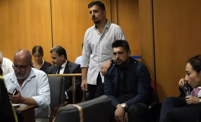 Andrea Varriale, top left, colleague of Italian Carabinieri paramilitary police officer Mario Cerciello Rega, and Paolo Cerciello Rega, his brother, attend the appeal trial of Gabriel Natale-Hjorth and Finnegan Lee Elder where they are accused of slaying the Carabinieri paramilitary police officer in Rome, Wednesday, July 3, 2024. (AP Photo/ Alessandra Tarantino)