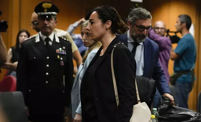Rosa Maria Esilio, widow of Italian Carabinieri paramilitary police officer Mario Cerciello Rega, leaves after the reading of the judgment of the appeals trial for his murder, in Rome, Wednesday, July 3, 2024. (AP Photo/Alessandra Tarantino)