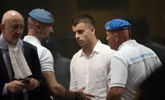 Gabriel Natale Hjorth leaves at the end of a hearing for the appeals trial in which he is facing murder charges for killing Italian Carabinieri paramilitary police officer Mario Cerciello Rega, in Rome, Wednesday, July 3, 2024. Two American men face a new trial in the slaying of an Italian plainclothes police officer during a botched sting operation after Italy's highest court threw out their convictions. (AP Photo/ Alessandra Tarantino)