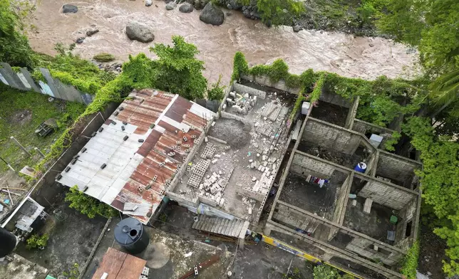 An aerial view of a home damaged by Hurricane Beryl in Kingston, Jamaica, Thursday, July 4, 2024. (AP Photo/Leo Hudson)