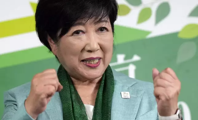 FILE - Incumbent Tokyo Gov. Yuriko Koike celebrates after she was elected for Tokyo's gubernatorial election in Tokyo, Sunday, July 7, 2024. Multiple women competing for a top political office is still rare in Japan, but Koike’s win highlights a gradual rise in powerful female officials and a society more open to gender balance in politics. That said, even if a woman eventually becomes prime minister, politics here is still overwhelmingly dominated by men, and experts see a huge effort needed for equal representation. (AP Photo/Hiro Komae, File)