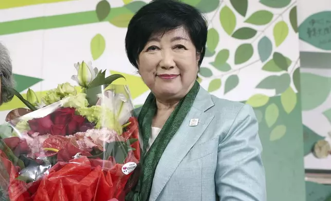 Incumbent Tokyo Gov. Yuriko Koike celebrates after she was elected for Tokyo's gubernatorial election in Tokyo, Sunday, July 7, 2024. (Kyodo News via AP)