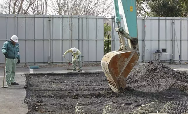 FILE - A power shovel is used on Feb. 21, 2011 to dig the site of a former medical school in Tokyo linked to Unit 731, a germ and biological warfare outfit during the war. (AP Photo/Koji Sasahara, File)