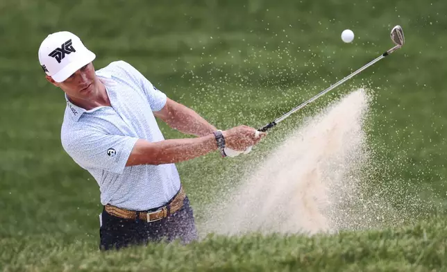 Eric Cole sinks a bunker shot for birdie on the seventh hole at the John Deere Classic golf tournament Friday, July 5, 2024, at TPC Deere Run in Silvis, Ill. (Roy Dabner/Quad City Times via AP)