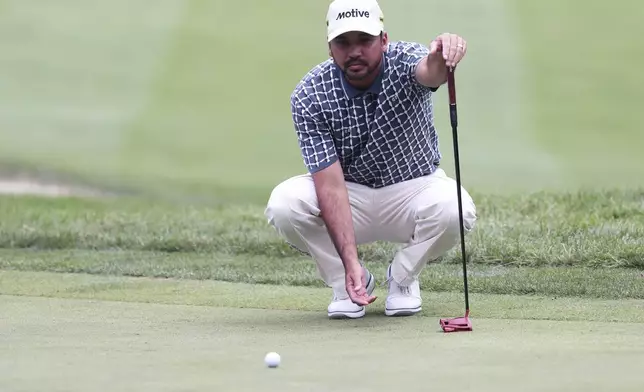 Jason Day lines up his putt on the seventh hole at the John Deere Classic golf tournament Friday, July 5, 2024, at TPC Deere Run in Silvis, Ill. (Roy Dabner/Quad City Times via AP)