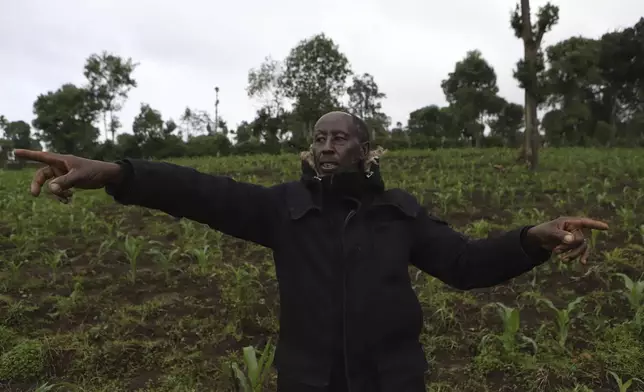 Farmer James Tobiko on his vegetable farm that wasn't affected by flooding due to terracing in Narok, Kenya, Wednesday, May 8, 2024. According to Kenya's interior ministry, the heavy rains affected 400,000 people across the country and killed 289. Crops on approximately 168,092 acres of land have been destroyed, posing a threat to food security. This represents 0.24 percent of Kenya's based on World Bank Data that shows 48% of Kenya's land is agricultural. (AP Photo/Andrew Kasuku)